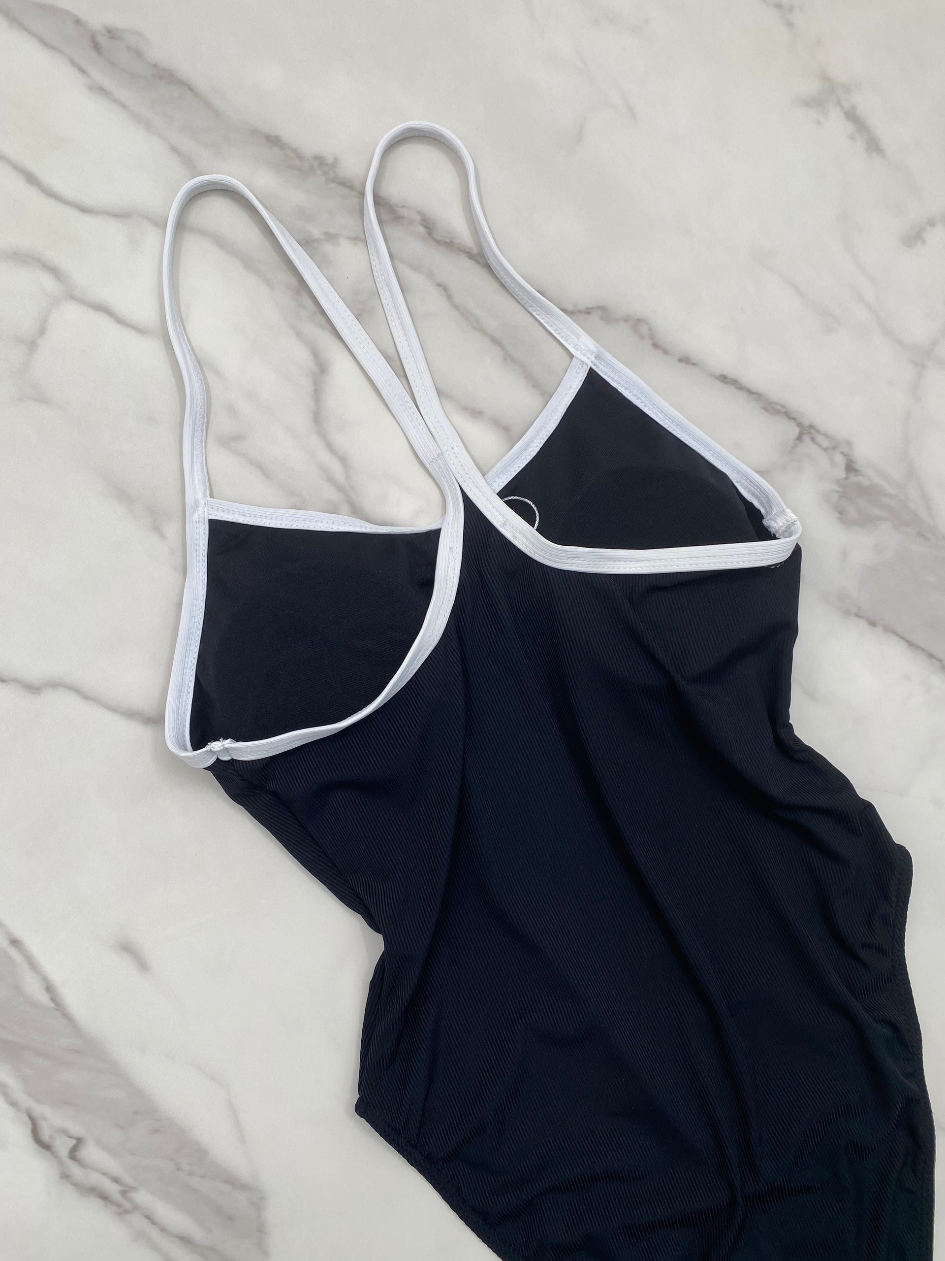 Black one piece with white lining