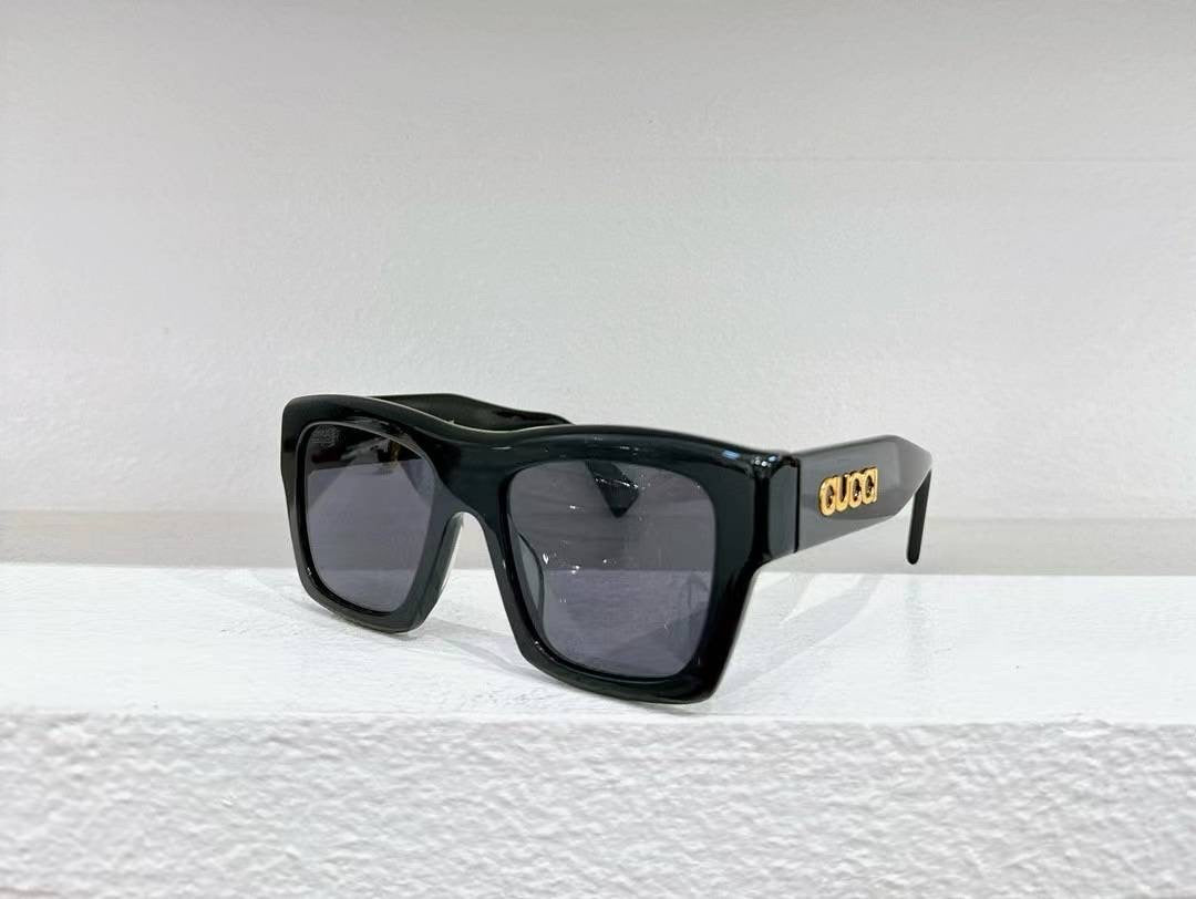 Thick black sunglasses