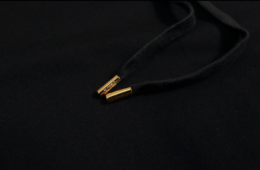 Oversized hoodie with gold accessories