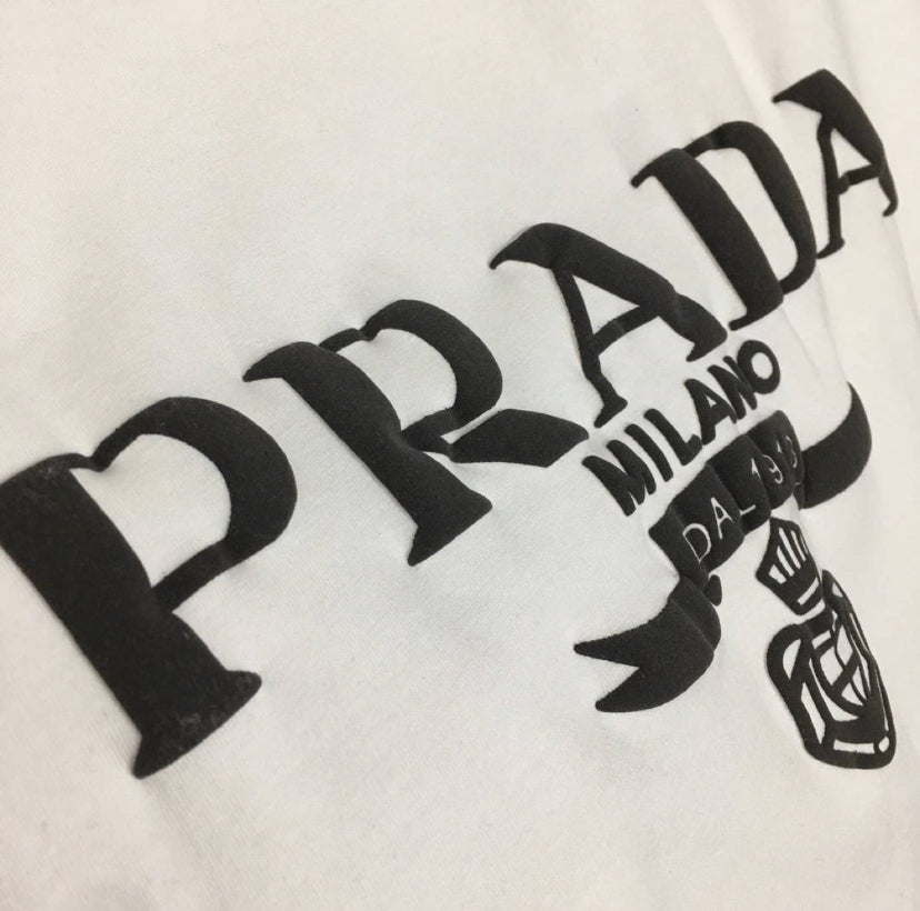 White t shirt with black writing