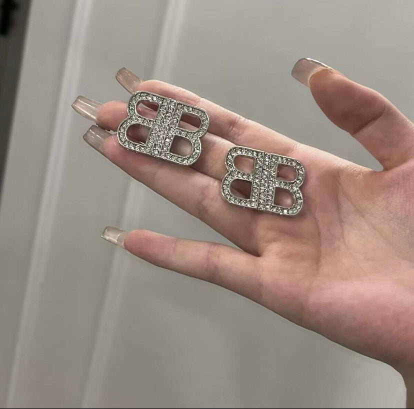 Pendientes grandes deslumbrados en plata