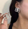 Large silver bedazzled earrings